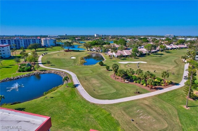 bird's eye view with view of golf course and a water view