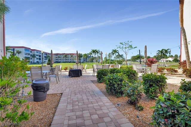 view of home's community with a patio area