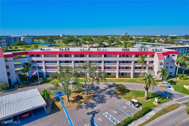 view of property with uncovered parking