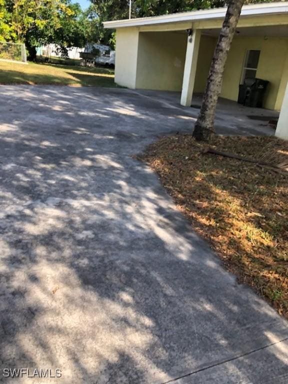 view of side of home featuring a carport