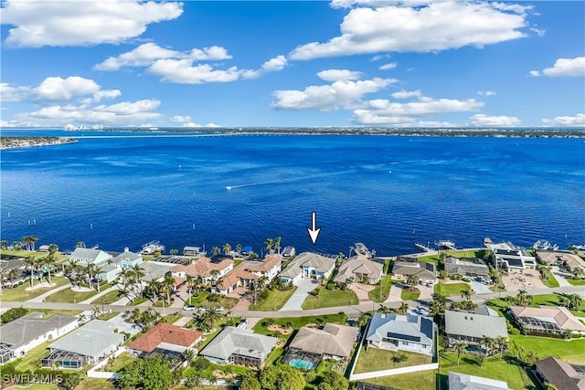 birds eye view of property with a water view