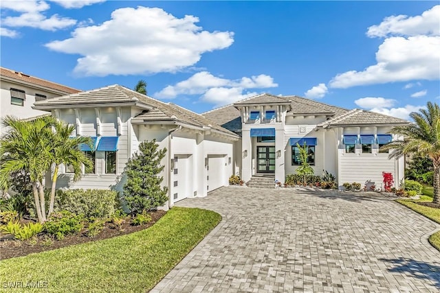 mediterranean / spanish-style house featuring a garage