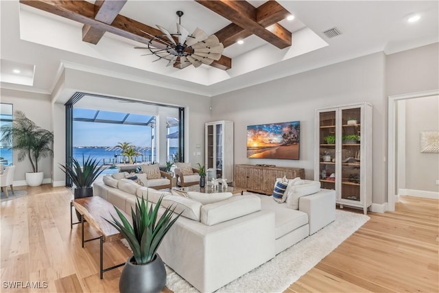 living room with coffered ceiling, a towering ceiling, ceiling fan, beam ceiling, and light hardwood / wood-style floors