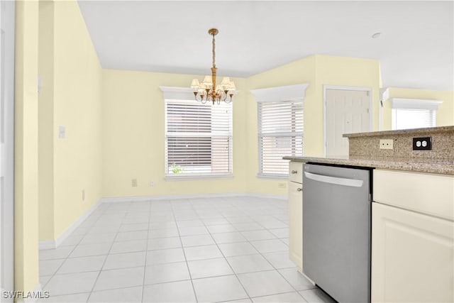 kitchen with a chandelier, pendant lighting, stainless steel dishwasher, and a wealth of natural light