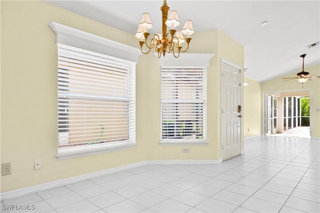 unfurnished room featuring ceiling fan with notable chandelier, light tile patterned floors, and vaulted ceiling