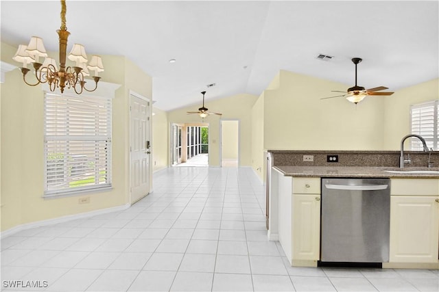 kitchen with sink, stainless steel dishwasher, lofted ceiling, light tile patterned floors, and ceiling fan with notable chandelier