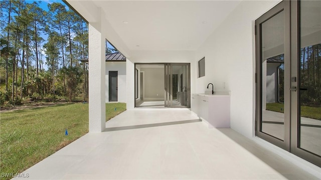 view of patio / terrace with sink, exterior kitchen, and french doors