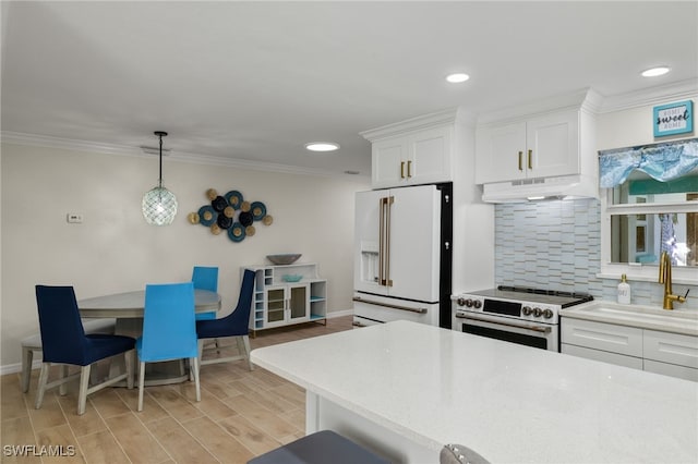 kitchen featuring white cabinetry, sink, decorative light fixtures, decorative backsplash, and high end appliances