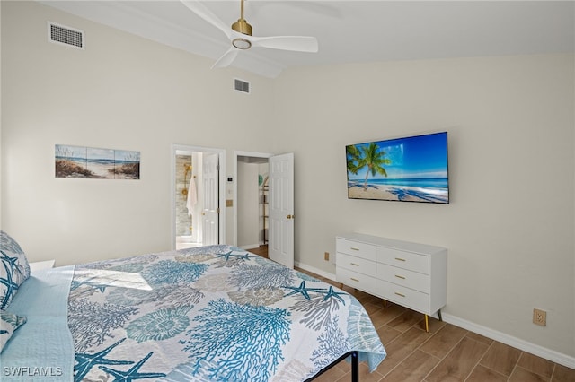 bedroom featuring hardwood / wood-style flooring, high vaulted ceiling, and ceiling fan