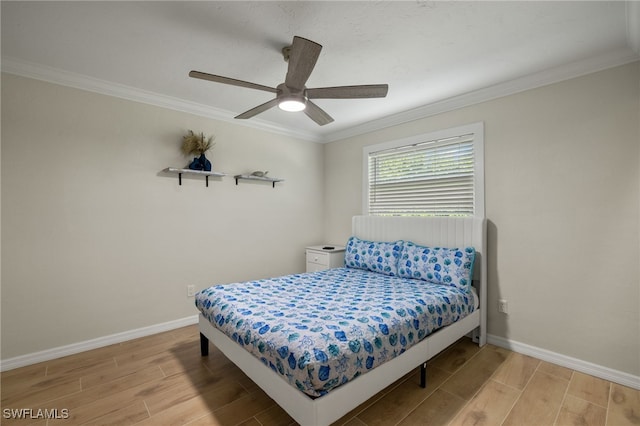 bedroom featuring light hardwood / wood-style flooring, ceiling fan, and crown molding