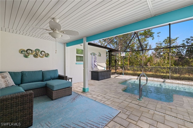 view of swimming pool with a lanai, ceiling fan, a patio area, and an outdoor hangout area