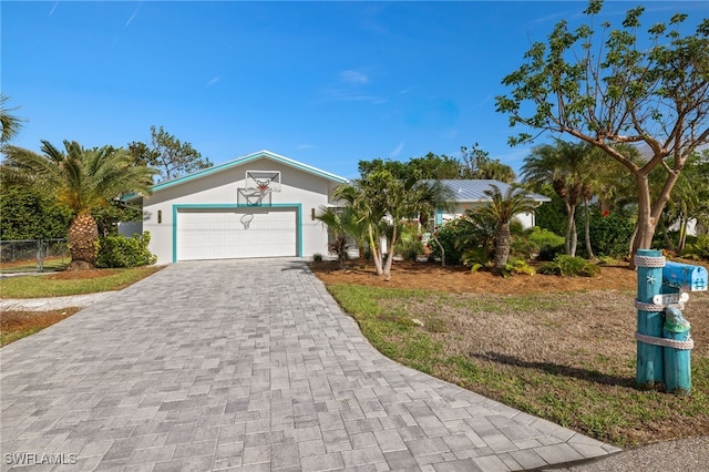 single story home featuring a garage