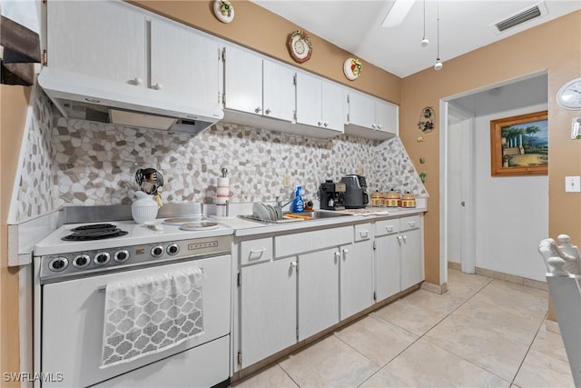 kitchen featuring white stove, white cabinets, sink, ceiling fan, and tasteful backsplash