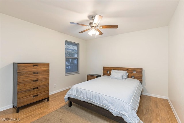 bedroom featuring ceiling fan and light wood-type flooring