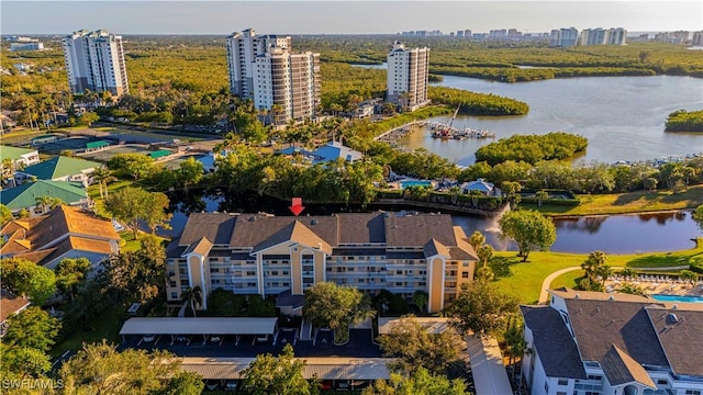 birds eye view of property with a water view