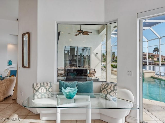 dining room featuring ceiling fan and light tile patterned flooring