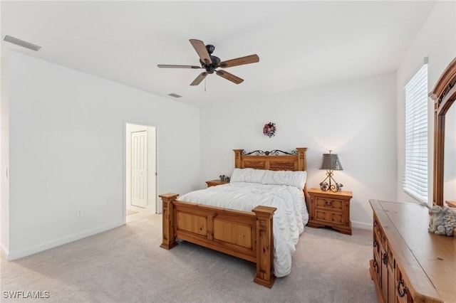 bedroom featuring ceiling fan and light carpet