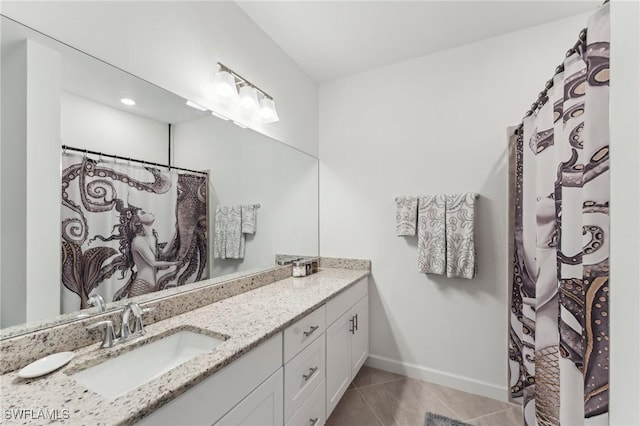 bathroom featuring tile patterned floors, vanity, and a shower with curtain