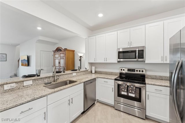 kitchen with white cabinetry and stainless steel appliances