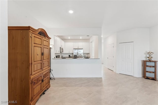 interior space with light tile patterned floors