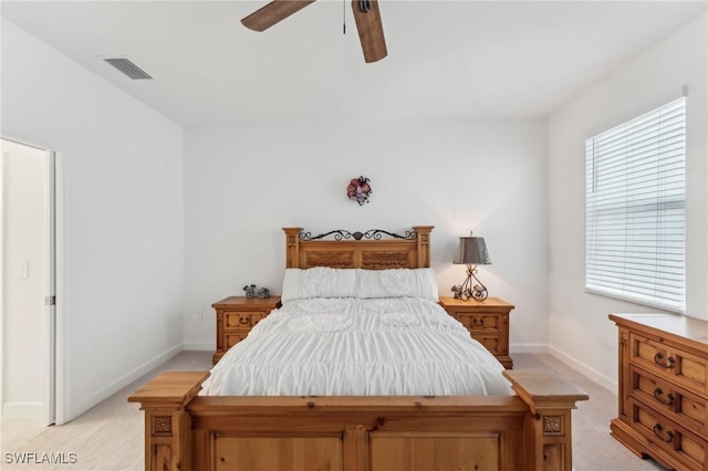 bedroom with ceiling fan and light colored carpet