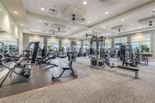 exercise room with a drop ceiling and ceiling fan