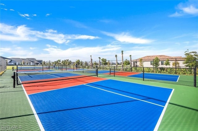 view of sport court with basketball hoop