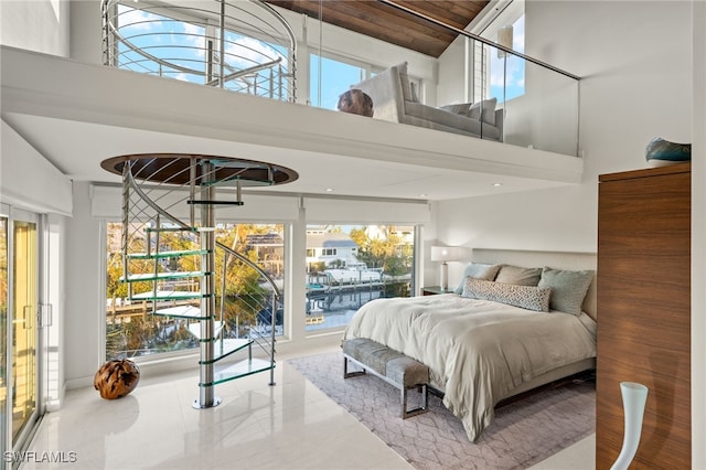 bedroom featuring a high ceiling