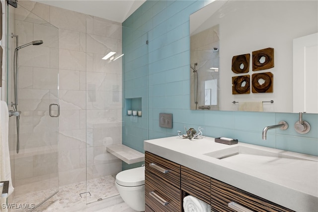 bathroom with toilet, a shower with shower door, vanity, decorative backsplash, and lofted ceiling