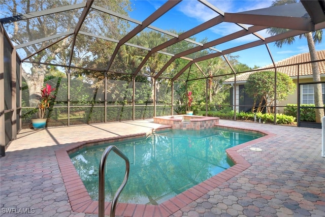 view of pool with a lanai, a pool with connected hot tub, and a patio