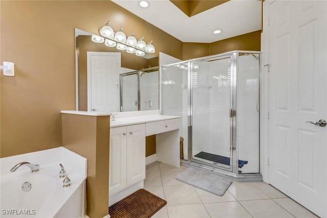 full bathroom with vanity, tile patterned flooring, a bath, and a shower stall