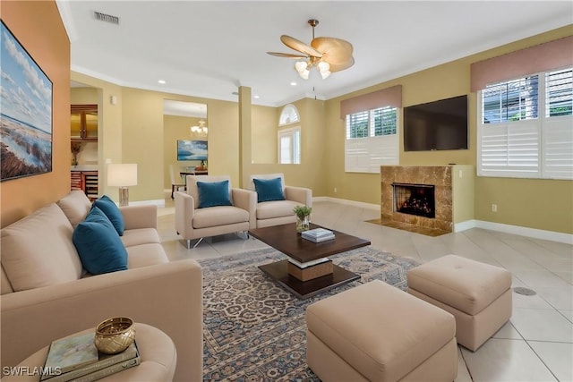 living room with light tile patterned floors, recessed lighting, a fireplace, and baseboards