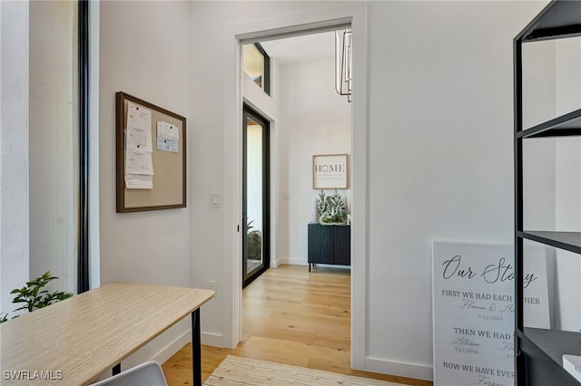 hall with light wood-type flooring