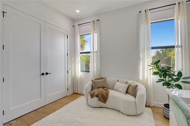 sitting room featuring light hardwood / wood-style flooring