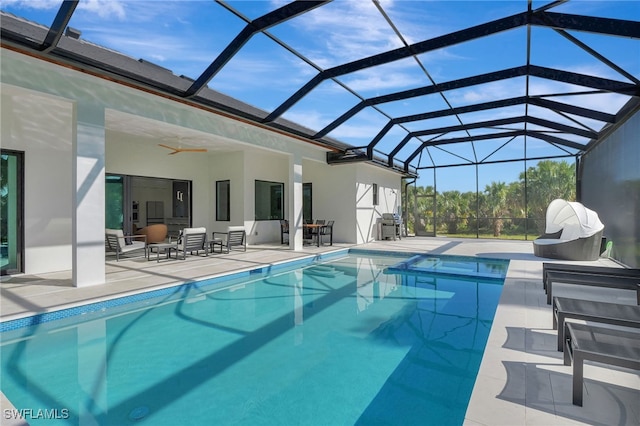 view of pool with a lanai, an outdoor hangout area, and a patio area