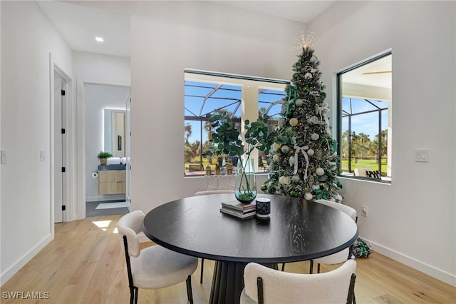 dining space featuring light wood-type flooring