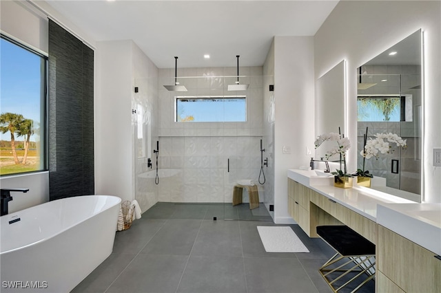 bathroom featuring vanity, tile patterned floors, and shower with separate bathtub