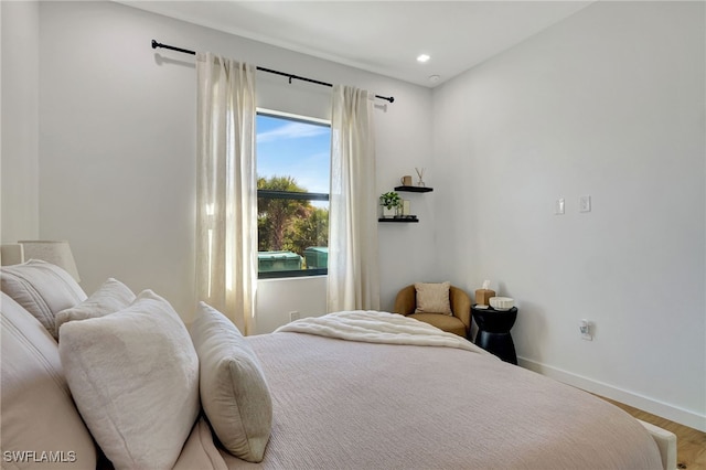 bedroom with hardwood / wood-style flooring