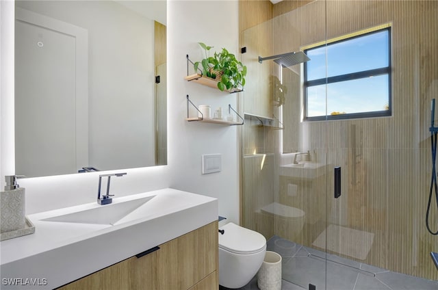 bathroom featuring vanity, a shower with door, and toilet