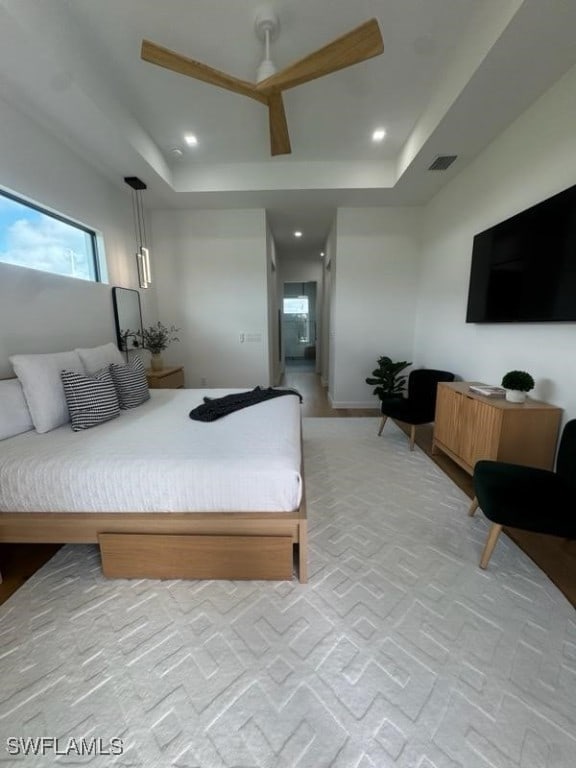 bedroom with a raised ceiling