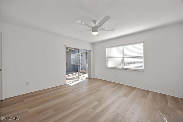 spare room with light hardwood / wood-style flooring and ceiling fan