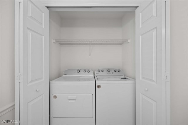 washroom featuring independent washer and dryer