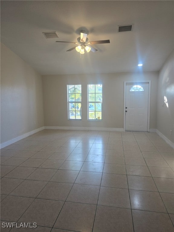 foyer entrance featuring ceiling fan and light tile patterned flooring