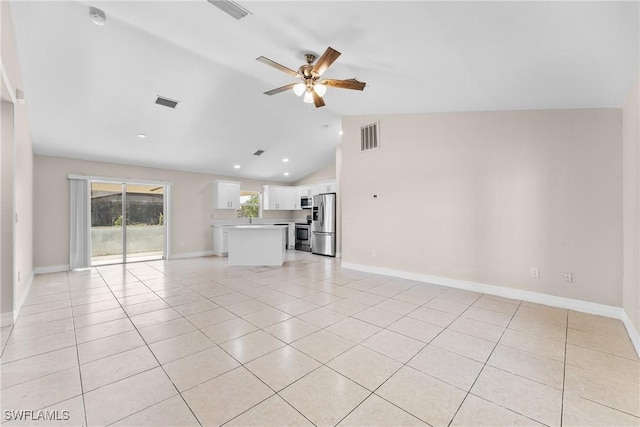 2207 NE 16th Pl, Cape Coral, FL 33909 - unfurnished living room with visible vents, light tile patterned floors, ceiling fan, and vaulted ceiling