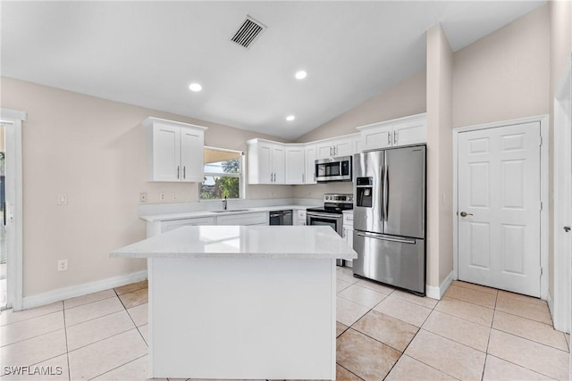 2207 NE 16th Pl, Cape Coral, FL 33909 - kitchen with a sink, stainless steel appliances, visible vents, white cabinetry, and baseboards