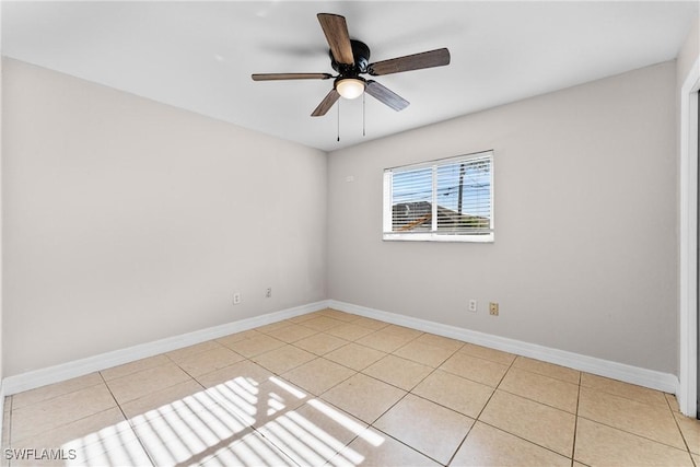 2207 NE 16th Pl, Cape Coral, FL 33909 - unfurnished room featuring light tile patterned flooring, ceiling fan, and baseboards