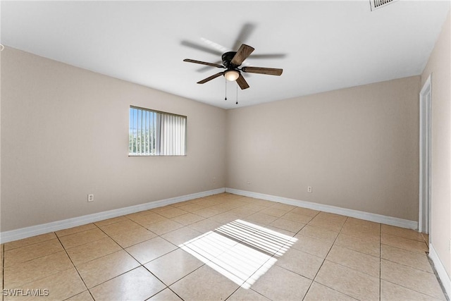2207 NE 16th Pl, Cape Coral, FL 33909 - spare room featuring light tile patterned floors, a ceiling fan, and baseboards
