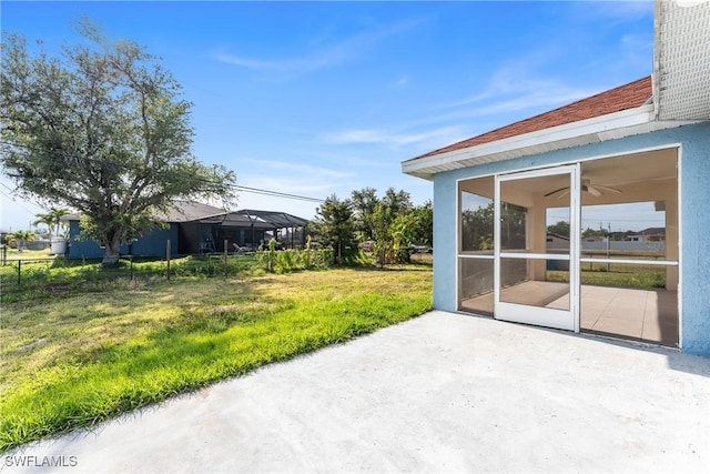 2207 NE 16th Pl, Cape Coral, FL 33909 - view of patio featuring a sunroom and ceiling fan
