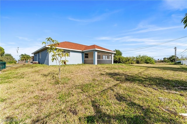 2207 NE 16th Pl, Cape Coral, FL 33909 - exterior space with a lawn and stucco siding