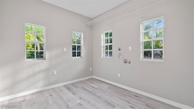 laundry room with electric dryer hookup, light wood-type flooring, and hookup for a washing machine